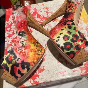 Colorful peep toe pumps with a cork style heel. Worn in a fashion show only.